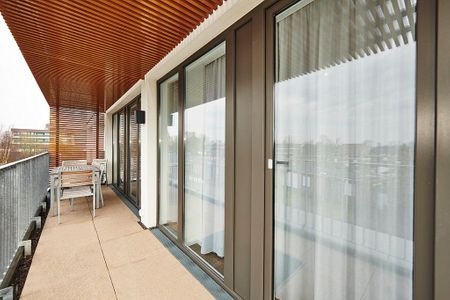 Deichhäuser Anna Küste Deichhäuser Anna Küste 4-33 Bensersiel - Überdachter Balkon mit Sitzgelegenheit