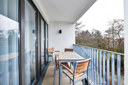 Deichhäuser Anna Küste Deichhäuser Anna Küste 4-34 Bensersiel - Überdachter Balkon mit Sitzgelegenheit