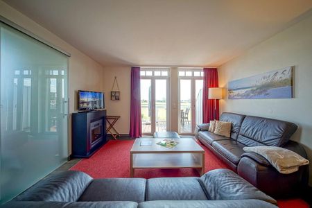 Resort Deichgraf Resort Deichgraf 27-21 Wremen - Wohn-Essbereich mit Couch