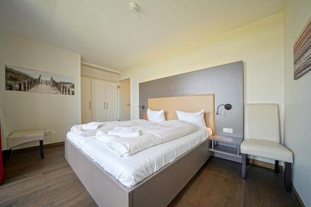 Resort Deichgraf Resort Deichgraf 27-21 Wremen - Schlafzimmer mit Doppelbett