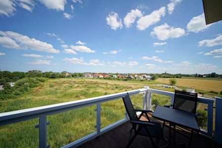 Resort Deichgraf Resort Deichgraf 27-21 Wremen - Balkon mit Gartenmöbeln