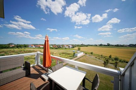 Resort Deichgraf Resort Deichgraf 27-21 Wremen - Balkon mit Gartenmöbeln