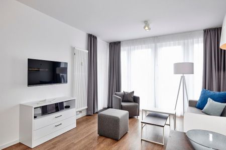 Deichhäuser Anna Küste Deichhäuser Anna Küste 4-14 Bensersiel - Wohnbereich mit Flatscreen-TV