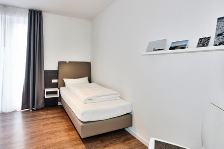 Deichhäuser Anna Küste Deichhäuser Anna Küste 4-14 Bensersiel - Schlafzimmer mit zwei Einzelbetten