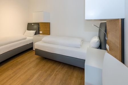 Deichhäuser Anna Küste Deichhäuser Anna Küste 6-11 Bensersiel - Schlafzimmer mit zwei Boxspringbetten