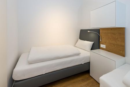 Deichhäuser Anna Küste Deichhäuser Anna Küste 6-11 Bensersiel - Schlafzimmer mit zwei Boxspringbetten