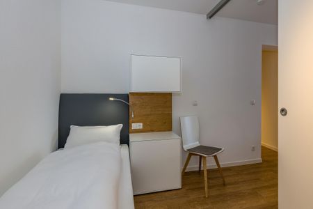 Deichhäuser Anna Küste Deichhäuser Anna Küste 6-11 Bensersiel - Schlafzimmer mit zwei Boxspringbetten