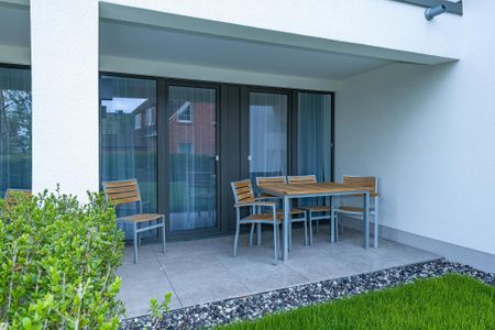 Deichhäuser Anna Küste Deichhäuser Anna Küste 6-11 Bensersiel - Terrasse mit Sitzgelegenheiten