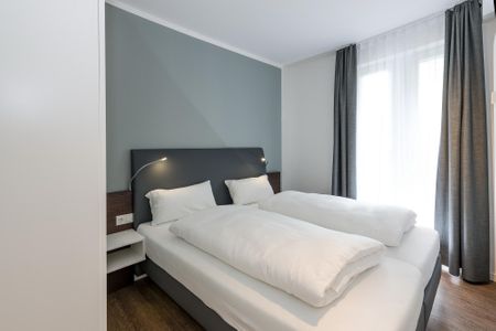 Deichhäuser Anna Küste Deichhäuser Anna Küste 6-13 Bensersiel - Schlafzimmer mit Doppelbett