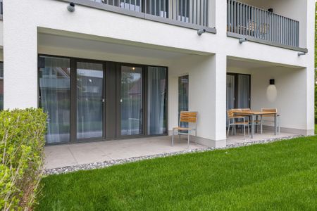 Deichhäuser Anna Küste Deichhäuser Anna Küste 6-13 Bensersiel - Überdachte Terrasse mit Sitzgelegenheit
