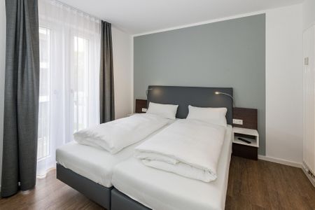 Deichhäuser Anna Küste Deichhäuser Anna Küste 6-20 Bensersiel - Schlafzimmer mit Doppelbett