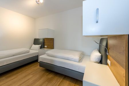 Deichhäuser Anna Küste Deichhäuser Anna Küste 6-21 Bensersiel - Schlafzimmer mit zwei Einzelbetten