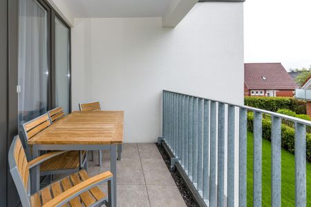 Deichhäuser Anna Küste Deichhäuser Anna Küste 6-21 Bensersiel - Überdachter Balkon mit Sitzgelegenheit