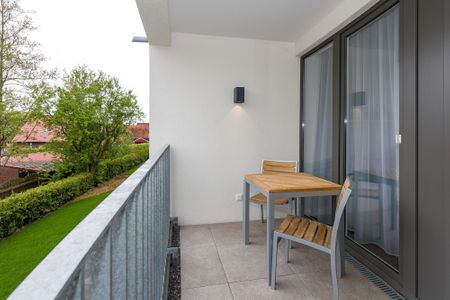 Deichhäuser Anna Küste Deichhäuser Anna Küste 6-22 Bensersiel - Überdachter Balkon mit Sitzgelegenheit