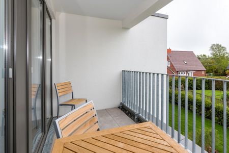 Deichhäuser Anna Küste Deichhäuser Anna Küste 6-22 Bensersiel - Überdachter Balkon mit Sitzgelegenheit
