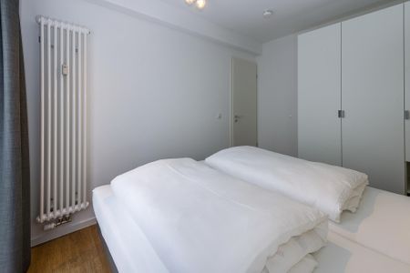 Deichhäuser Anna Küste Deichhäuser Anna Küste 6-23 Bensersiel - Schlafzimmer mit Doppelbett und Kleiderschrank