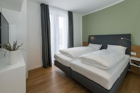Deichhäuser Anna Küste Deichhäuser Anna Küste 6-30 Bensersiel - Schlafzimmer mit Doppelbett und Flatscreen TV - gbmv0-01 - Großenbrode