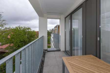 Deichhäuser Anna Küste Deichhäuser Anna Küste 6-31 Bensersiel - Überdachter Balkon mit Sitzgelegenheit