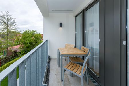 Deichhäuser Anna Küste Deichhäuser Anna Küste 6-32 Bensersiel - Überdachter Balkon mit Sitzgelegenheit