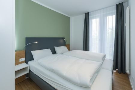 Deichhäuser Anna Küste Deichhäuser Anna Küste 6-33 Bensersiel - Schlafzimmer mit Doppelbett