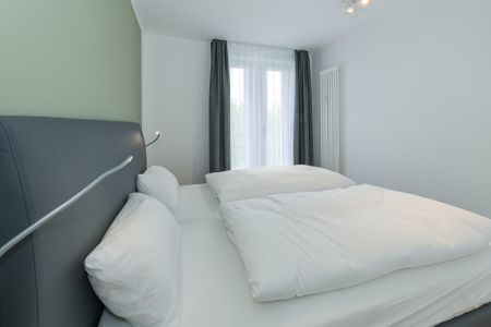 Deichhäuser Anna Küste Deichhäuser Anna Küste 6-33 Bensersiel - Schlafzimmer mit Doppelbett