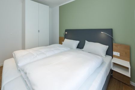 Deichhäuser Anna Küste Deichhäuser Anna Küste 6-33 Bensersiel - Schlafzimmer mit Doppelbett