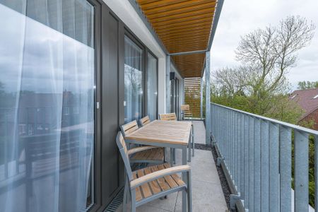 Deichhäuser Anna Küste Deichhäuser Anna Küste 6-33 Bensersiel - Balkon mit Tisch und Sitzgelegenheiten