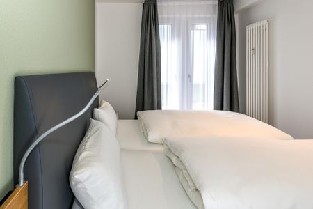 Deichhäuser Anna Küste Deichhäuser Anna Küste 7-13 Bensersiel - Schlafzimmer mit Doppelbett