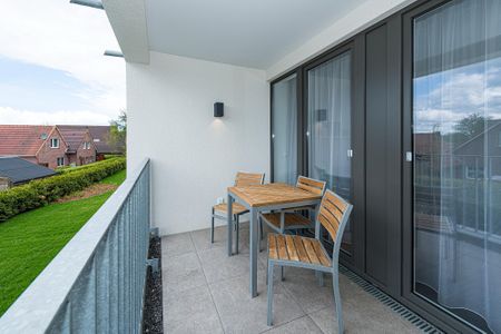 Deichhäuser Anna Küste Deichhäuser Anna Küste 7-22 Bensersiel - Überdachter Balkon mit Sitzgelegenheit