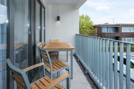 Deichhäuser Anna Küste Deichhäuser Anna Küste 7-24 Bensersiel - Überdachter Balkon mit Sitzgelegenheit