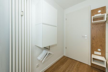 Deichhäuser Anna Küste Deichhäuser Anna Küste 7-30 Bensersiel - Flur mit Garderobe