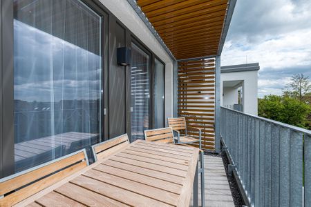 Deichhäuser Anna Küste Deichhäuser Anna Küste 7-30 Bensersiel - Überdachter Balkon mit Sitzgelegenheit