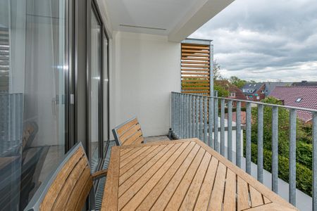 Deichhäuser Anna Küste Deichhäuser Anna Küste 7-32 Bensersiel - Überdachter Balkon mit Sitzgelegenheit