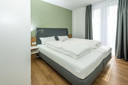 Deichhäuser Anna Küste Deichhäuser Anna Küste 7-33 Bensersiel - Schlafzimmer mit Doppelbett