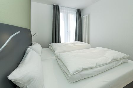 Deichhäuser Anna Küste Deichhäuser Anna Küste 7-33 Bensersiel - Schlafzimmer mit Doppelbett