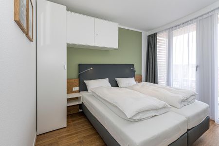 Deichhäuser Anna Küste Deichhäuser Anna Küste 7-33 Bensersiel - Schlafzimmer mit Doppelbett
