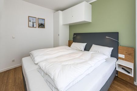 Deichhäuser Anna Küste Deichhäuser Anna Küste 7-33 Bensersiel - Schlafzimmer mit Doppelbett
