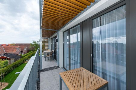 Deichhäuser Anna Küste Deichhäuser Anna Küste 7-33 Bensersiel - Balkon mit Gartenmöbeln