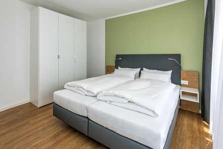 Deichhäuser Anna Küste Deichhäuser Anna Küste 7-34 Bensersiel - Schlafzimmer mit Doppelbett