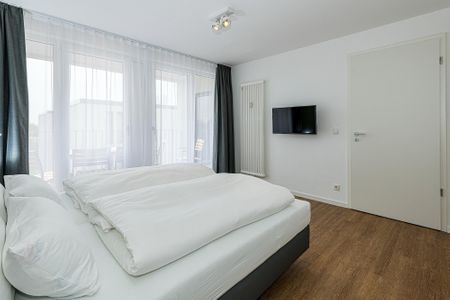 Deichhäuser Anna Küste Deichhäuser Anna Küste 7-34 Bensersiel - Schlafzimmer mit Doppelbett