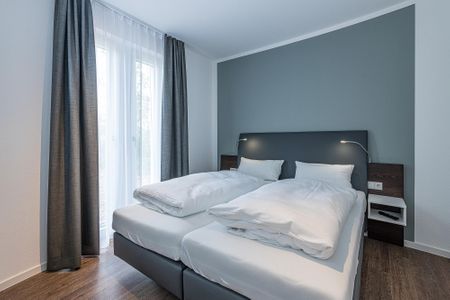 Deichhäuser Anna Küste Deichhäuser Anna Küste 8-10 Bensersiel - Schlafzimmer mit Doppelbett