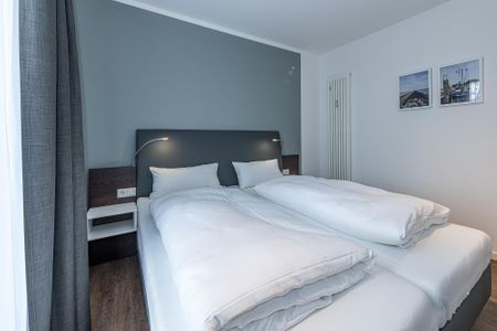 Deichhäuser Anna Küste Deichhäuser Anna Küste 8-10 Bensersiel - Schlafzimmer mit Doppelbett