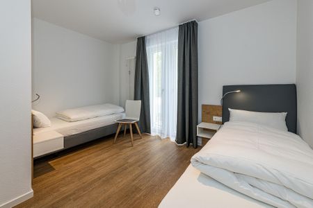 Deichhäuser Anna Küste Deichhäuser Anna Küste 8-14 Bensersiel - Schlafzimmer mit zwei Einzelbetten