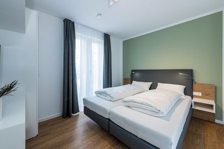 Deichhäuser Anna Küste Deichhäuser Anna Küste 8-20 Bensersiel - Schlafzimmer mit Doppelbett