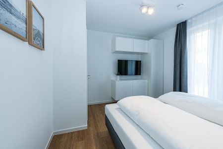 Deichhäuser Anna Küste Deichhäuser Anna Küste 8-20 Bensersiel - Schlafzimmer mit Doppelbett
