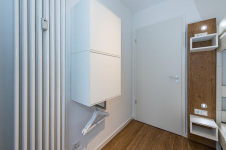 Deichhäuser Anna Küste Deichhäuser Anna Küste 8-20 Bensersiel - Schlafzimmer mit Etagenbett