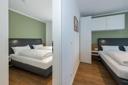 Deichhäuser Anna Küste Deichhäuser Anna Küste 8-23 Bensersiel - Schlafzimmer mit Doppelbett