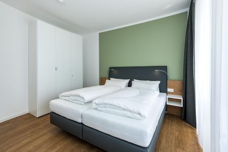 Deichhäuser Anna Küste Deichhäuser Anna Küste 8-24 Bensersiel - Schlafzimmer mit Doppelbett