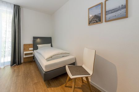Deichhäuser Anna Küste Deichhäuser Anna Küste 8-24 Bensersiel - Schlafzimmer mit zwei Einzelbetten