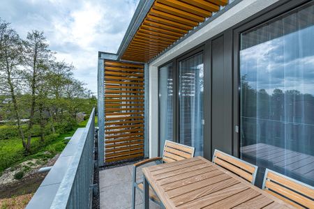 Deichhäuser Anna Küste Deichhäuser Anna Küste 8-31 Bensersiel - Balkon mit Gartenmöbeln